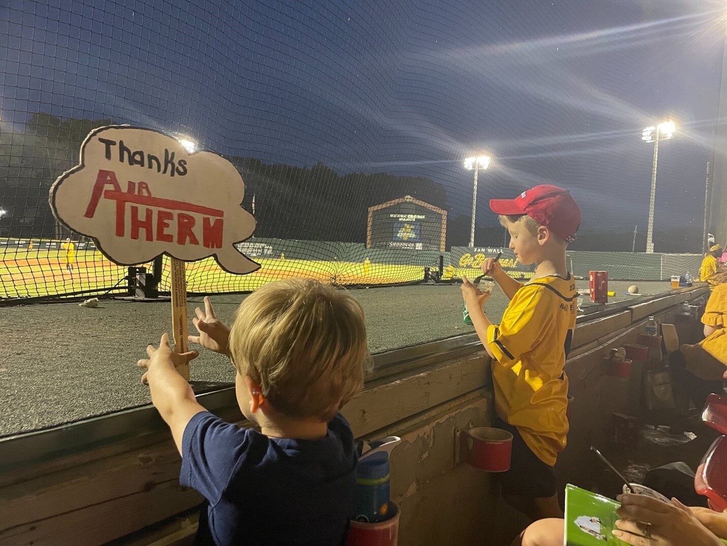 Family dressed in yellow having fun at a Savannah Banana Game