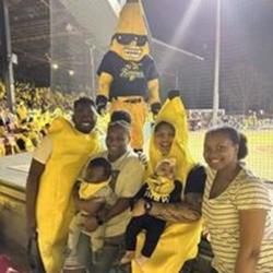 Family dressed in yellow having fun at a Savannah Banana Game 