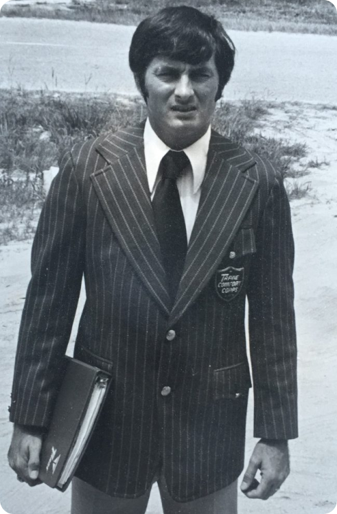 an old black and white photo of a man in a pinstripe suit